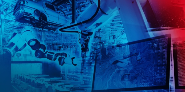 Zautomatyzowana produkcja samochodów przy użyciu robotów. Na pierwszym planie znajduje się monitor, na którym symulowane są procesy.