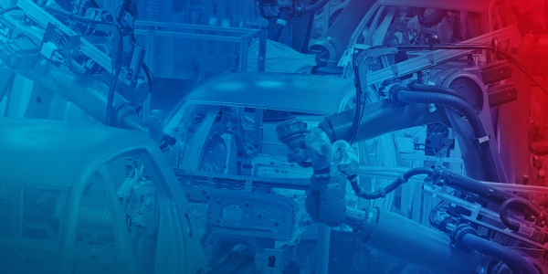 Zautomatyzowana produkcja samochodów: Roboty spawające karoserię samochodu.