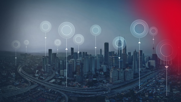 Bild zeigt das Realbild  einer Stadt. Als grafische Elemente wurden Punkte eingezeichnet, die die Nutzung digitaler Services symbolisieren.