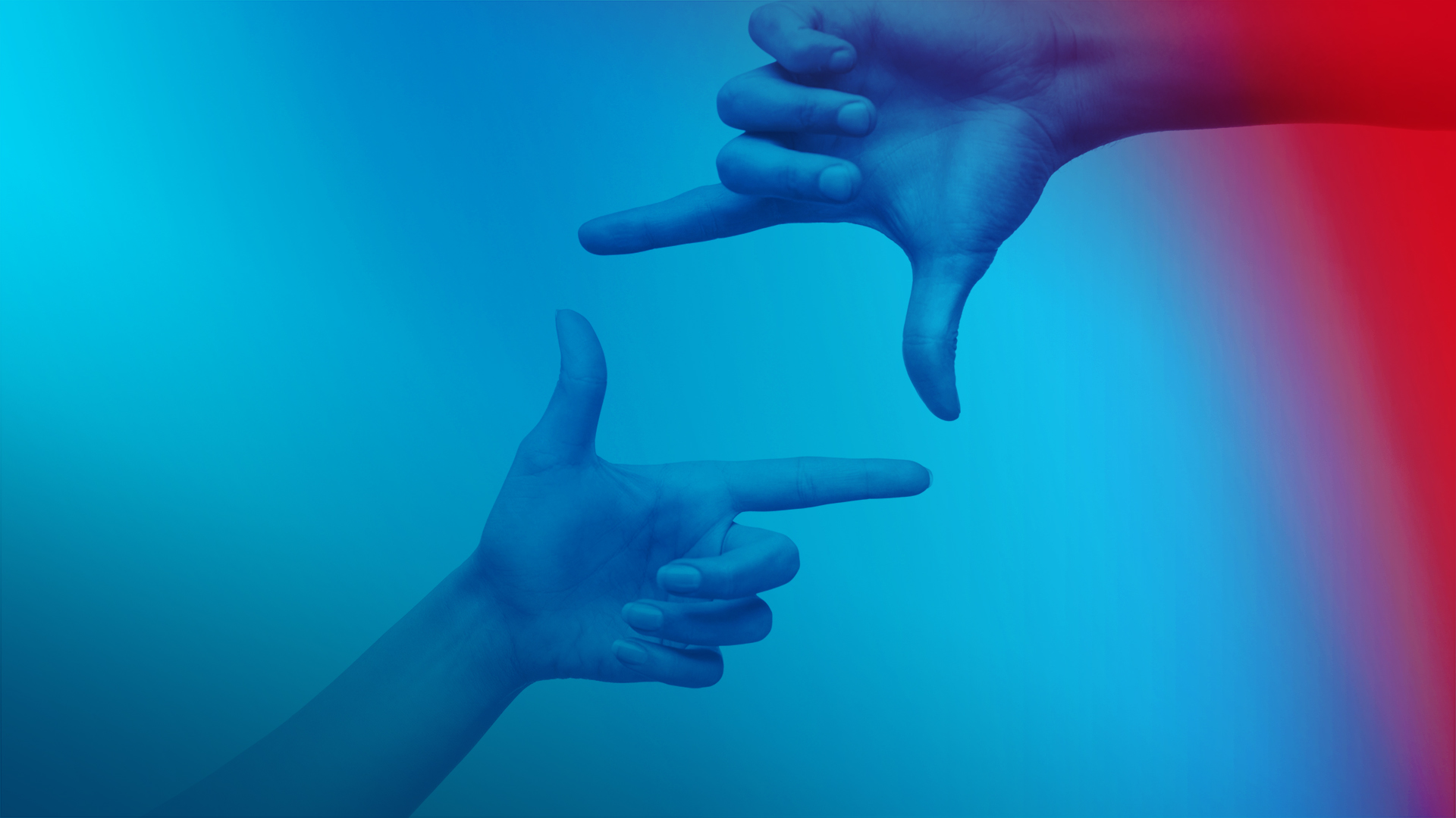 Dwie dłonie z kciukiem i palcem wskazującym tworzą symboliczny kwadrat.