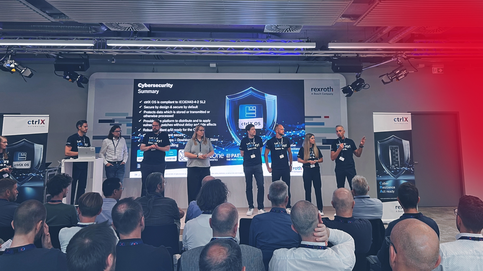 The picture shows the speakers of the Cybersecurity Day on stage during the Q&A session.